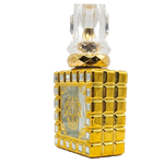 Square ornate perfume bottle with a gold-toned frame decorated with small reflective jewel details. The center features an intricate gold filigree damask pattern on clear glass, finished with a large multifaceted crystal-style cap and textured gold neck.