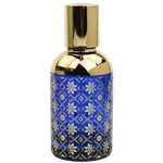 Cylindrical perfume bottle with a reflective gold cap and gold upper section. The lower half is  blue and decorated with an intricate geometric lattice pattern in gold.