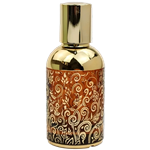 Cylindrical perfume bottle with a shiny gold cap and gold upper section. The lower half features a brown background with ornate gold swirling floral designs.