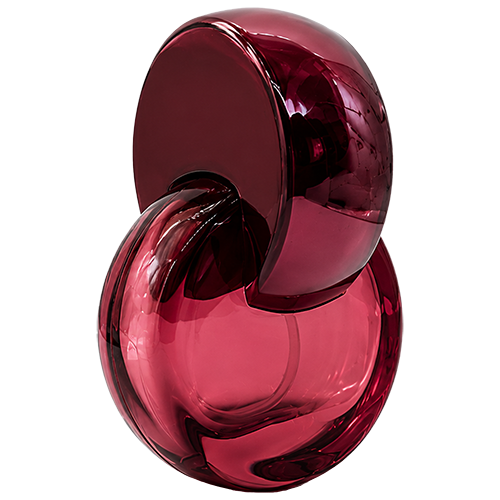 Red circular glass spray bottles featuring distinctive plastic semi circular arched loop cap that curve over the spray nozzles, with gold sprayer.